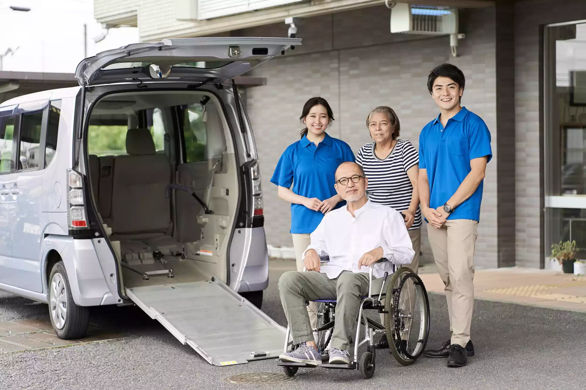 wheelchair-riding-elderly-and-caregivers-2025-03-14-11-35-47-utc