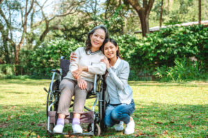Asian grandmother in wheelchair with daughter is enjoying at the